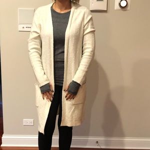 Long knot maternity sweater.